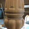 Carved pedestal table leg.