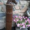 Carved column and horse head