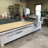 Some of our shop equipment. 4x8 CNC router with 8ft 4th axis (not shown) and a CNC lathe.